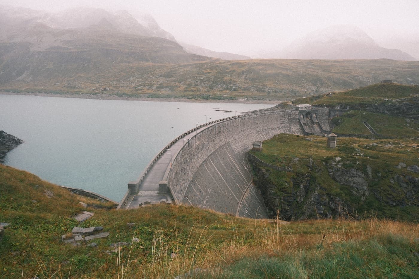 Large concrete dam with IoT water level and flow monitoring
